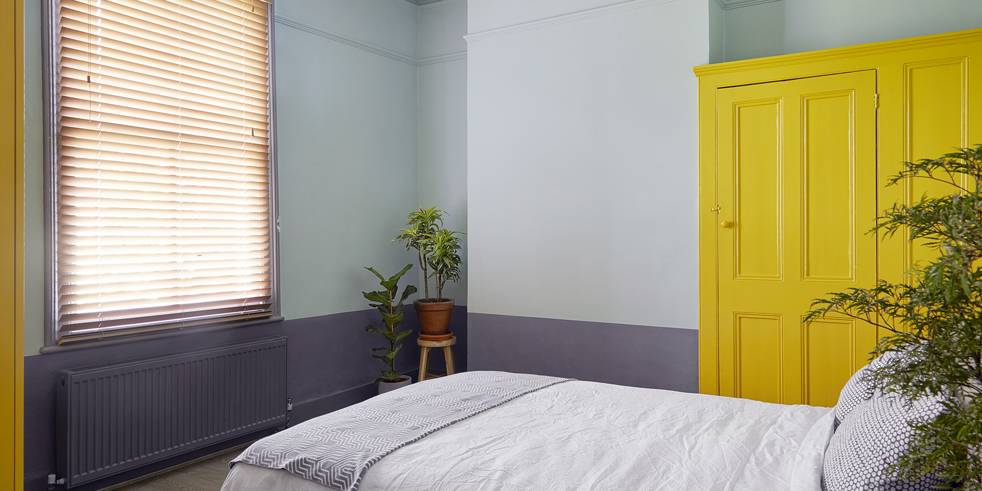 House of Sylphina London interior design - restaurant design, hotel design, shop design, retail design, hospitality design and workspace design. Bold yellow wardrobes in a neutral bedroom